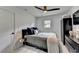 Clean bedroom with black furnishings, modern ceiling fan, and window with natural light at 3799 Sweetbriar Cir, Lithia Springs, GA 30122