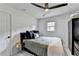 Comfortable bedroom features black furniture, gray walls and a modern ceiling fan at 3799 Sweetbriar Cir, Lithia Springs, GA 30122