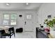 Bright dining area with modern lighting, white walls, and marble floors at 3799 Sweetbriar Cir, Lithia Springs, GA 30122