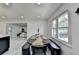 Bright dining area with modern lighting, white walls, and marble floors at 3799 Sweetbriar Cir, Lithia Springs, GA 30122