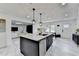 A kitchen features an island with seating, marble tile floors, and stainless steel appliances at 3799 Sweetbriar Cir, Lithia Springs, GA 30122