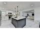 A kitchen features an island, marble tile floors, and stainless steel appliances at 3799 Sweetbriar Cir, Lithia Springs, GA 30122
