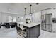A kitchen features an island, marble tile floors, and stainless steel appliances at 3799 Sweetbriar Cir, Lithia Springs, GA 30122