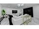 Staged living room with white marble floors, modern lighting, and stylish black and gold accents at 3799 Sweetbriar Cir, Lithia Springs, GA 30122