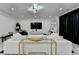 Bright living room featuring white furniture, modern lighting, and black accent curtains at 3799 Sweetbriar Cir, Lithia Springs, GA 30122