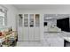 Bright open living room with bar, white walls, and modern accents throughout at 3799 Sweetbriar Cir, Lithia Springs, GA 30122