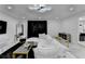 Open-concept living room with modern decor, bright recessed lights, and large black curtains at 3799 Sweetbriar Cir, Lithia Springs, GA 30122