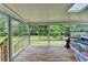 Bright and airy sun room with views of the lush green backyard at 3799 Sweetbriar Cir, Lithia Springs, GA 30122