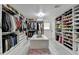 Expansive walk-in closet with custom storage, shelving, and dressing area at 3799 Sweetbriar Cir, Lithia Springs, GA 30122