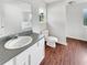 Bathroom with a vanity, toilet and a bathtub with a window at 4311 Marci St, Snellville, GA 30039