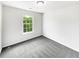 Bright bedroom featuring a large window and neutral carpet at 4311 Marci St, Snellville, GA 30039