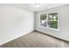 Cozy bedroom featuring a window with natural light and neutral carpet at 4311 Marci St, Snellville, GA 30039