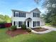 Charming two-story home with black shutters, a manicured lawn, and a driveway at 4311 Marci St, Snellville, GA 30039