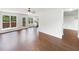 Living room with hardwood floors, a ceiling fan, and lots of natural light at 4311 Marci St, Snellville, GA 30039