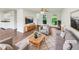 Bright, staged living room with hardwood floors, a ceiling fan, and lots of natural light at 4311 Marci St, Snellville, GA 30039