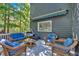Cozy back deck with wicker furniture and a view of the surrounding trees at 510 Watergate Ct, Roswell, GA 30076
