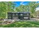 Beautiful backyard with a fire pit, patio seating, and a green lawn surrounded by lush trees at 510 Watergate Ct, Roswell, GA 30076