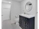 Bathroom with navy vanity with drawers and cabinets, white walls, and tiled floors at 510 Watergate Ct, Roswell, GA 30076