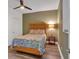 Comfortable bedroom with stylish wooden bedframe, patterned bedding, and decorative bedside lamp at 510 Watergate Ct, Roswell, GA 30076
