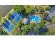 Aerial view of a community with swimming pool, tennis courts, parking, and lakeside access at 510 Watergate Ct, Roswell, GA 30076