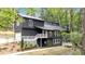 Charming two-story home featuring a spacious deck, modern siding, and lush greenery at 510 Watergate Ct, Roswell, GA 30076