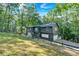 View of a two story home with neutral colored siding and an outdoor patio with white railings at 510 Watergate Ct, Roswell, GA 30076
