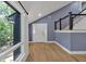 Spacious foyer with hardwood floors, a staircase, and a white front door at 510 Watergate Ct, Roswell, GA 30076