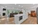 Open-concept living space featuring a kitchen island, dining area, and a cozy living room at 510 Watergate Ct, Roswell, GA 30076