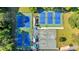 Aerial view of multiple tennis courts surrounded by greenery, perfect for active recreation at 510 Watergate Ct, Roswell, GA 30076