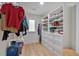 Well-organized walk-in closet with custom shelving, drawers, and hanging storage for shoes and clothing at 510 Watergate Ct, Roswell, GA 30076