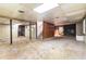 Spacious unfinished basement with exposed ceiling, support beams, and stairs at 2386 Springrun Way, Decatur, GA 30032