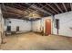 Unfinished basement with concrete floor and ceiling with exposed utilities at 2386 Springrun Way, Decatur, GA 30032