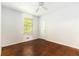 Bright bedroom features a window, ceiling fan, and hardwood floors at 2386 Springrun Way, Decatur, GA 30032