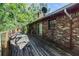 Exterior of home showing a wooden deck with a brick facade at 2386 Springrun Way, Decatur, GA 30032