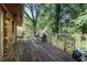 Exterior of home showing a wooden deck and a wooded yard at 2386 Springrun Way, Decatur, GA 30032