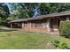 A charming single story home with a covered carport and well-manicured lawn at 2386 Springrun Way, Decatur, GA 30032