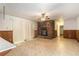 Gathering room with a brick fireplace, wood paneling, and sliding glass doors at 2386 Springrun Way, Decatur, GA 30032