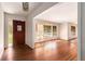 Bright living room with polished hardwood floors and large windows at 2386 Springrun Way, Decatur, GA 30032