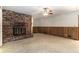 Living room featuring a brick fireplace and a ceiling fan with lights at 2386 Springrun Way, Decatur, GA 30032