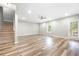 Spacious finished basement with wood-look flooring, natural light, and staircase at 307 Cochin Dr, Woodstock, GA 30188