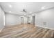 Open basement space with wood-look floors and recessed lighting at 307 Cochin Dr, Woodstock, GA 30188