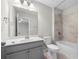 A neutral bathroom with a tub and shower and a gray vanity at 307 Cochin Dr, Woodstock, GA 30188