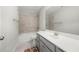 Contemporary bathroom featuring gray cabinets, white countertops, and a tiled shower at 307 Cochin Dr, Woodstock, GA 30188