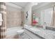 Bright bathroom with granite countertops, a bathtub, and tiled shower at 307 Cochin Dr, Woodstock, GA 30188