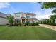 Beautiful two-story home with a well-manicured lawn, garden beds, and a welcoming entrance at 307 Cochin Dr, Woodstock, GA 30188