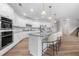 Spacious kitchen featuring stainless steel appliances, white cabinets, granite countertops, and a central island with bar seating at 307 Cochin Dr, Woodstock, GA 30188