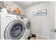 Laundry room featuring stainless steel washer and dryer at 307 Cochin Dr, Woodstock, GA 30188
