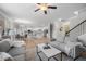 Open-concept living room with a seamless transition to a dining area and kitchen, creating an inviting space at 307 Cochin Dr, Woodstock, GA 30188