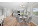 View of dining area to the staircase and a living room with a fireplace and built-in shelving at 307 Cochin Dr, Woodstock, GA 30188