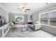 Bright loft features cozy seating, neutral decor, and large windows for ample sunlight at 307 Cochin Dr, Woodstock, GA 30188
